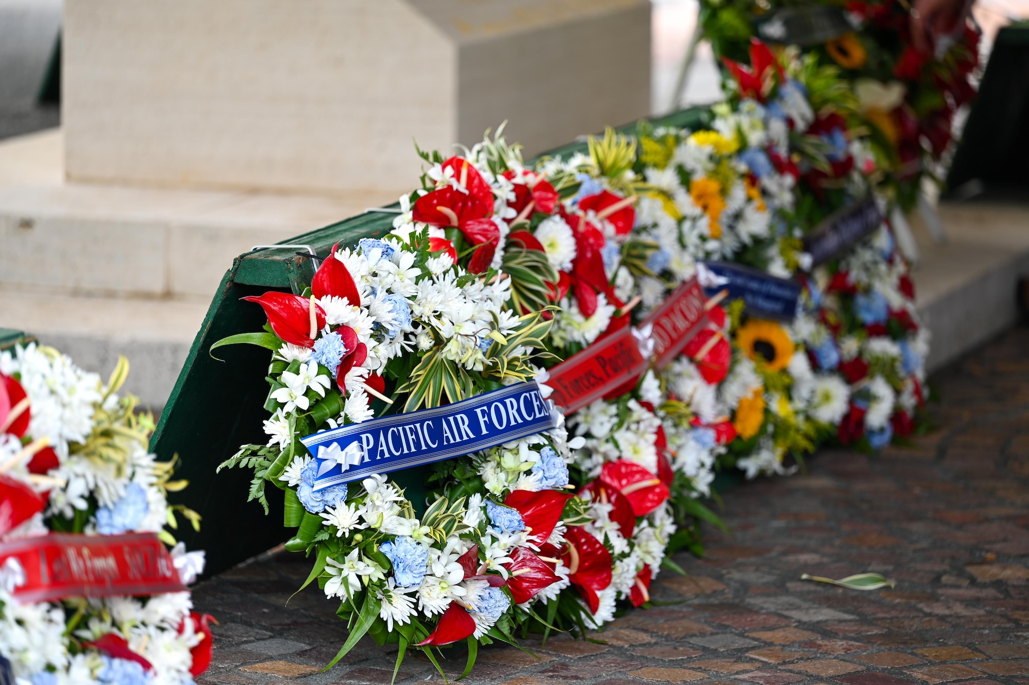 A wreath is laid by U.S. Air Force Gen. Kevin B. Schneider, Pacific Air Forces commander, in honor of Australian and New Zealand Army Corps Day at the National Memorial Cemetery of the Pacific, Honolulu, Hawaii, April 25, 2025. The event pays tribute to the legacy of the ANZAC and strengthens the enduring bond between nations. (U.S. Air Force photo by Senior Airman Melody Bordeaux)