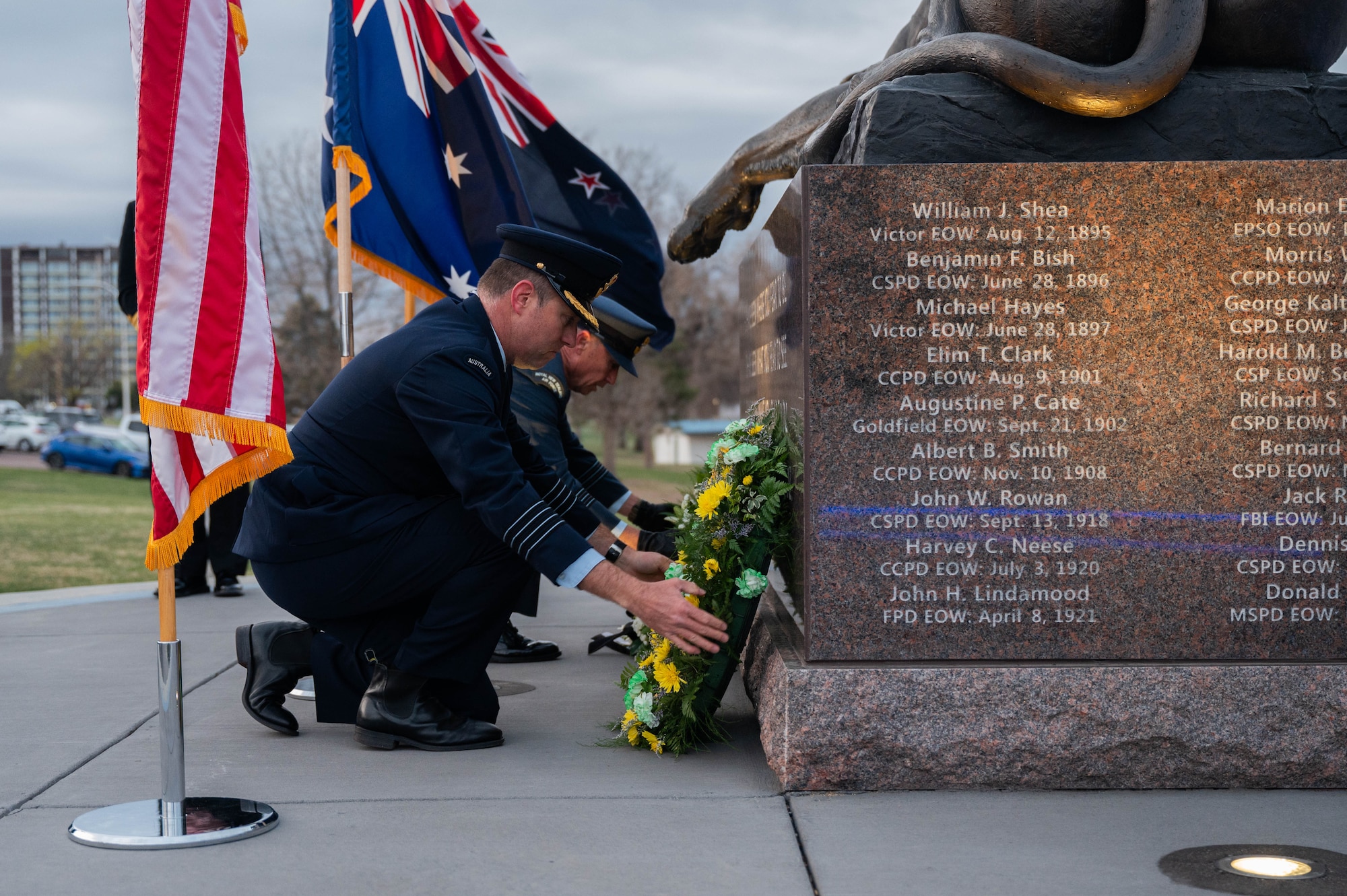 Col. Edgar Gonzalez and Lt. Col. Mark Waters lay flower wreaths at a memorial site in recognition of ANZAC Day in Colorado Springs.