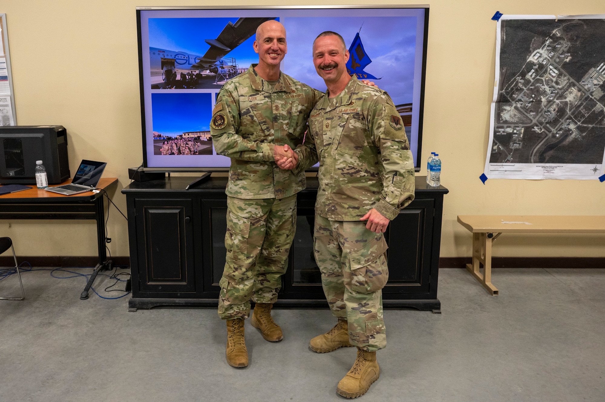 Chief Master Sgt. of the Air Force David Flosi coins Master Sgt. Robert Sommerfield, A4 air transportation manager, assigned to the 22nd Air Task Force, after a tour at Tyndall Air Force Base, Florida, April 16, 2025. The 22nd ATF is participating in rigorous exercises and diverse training programs to ensure Airmen are fully prepared to execute assigned missions. (U.S. Air Force photo by Airman 1st Class Samantha Thorn).