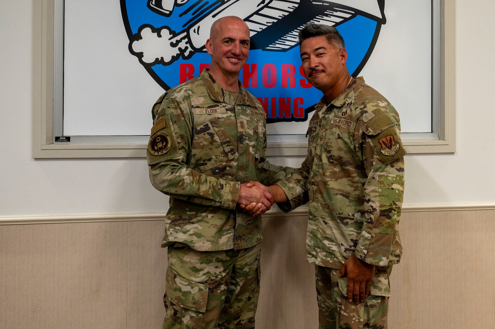 Chief Master Sgt. of the Air Force David Flosi coins Master Sgt. Jermey Reyes Hively, section chief of emergency management contingency training assigned to the 801st Red Horse Training Squadron, after a tour at Tyndall Air Force Base, Florida, April 16, 2025. The 22nd Air Task Force is participating in rigorous exercises and diverse training programs to ensure Airmen are fully prepared to execute assigned missions. (U.S. Air Force photo by Airman 1st Class Samantha Thorn)