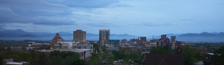 A view of the Asheville, North Carolina skyline at sunrise, April 25, 2025. Asheville was one of many impacted cities and towns in Western North Carolina recovering from Hurricane Helene