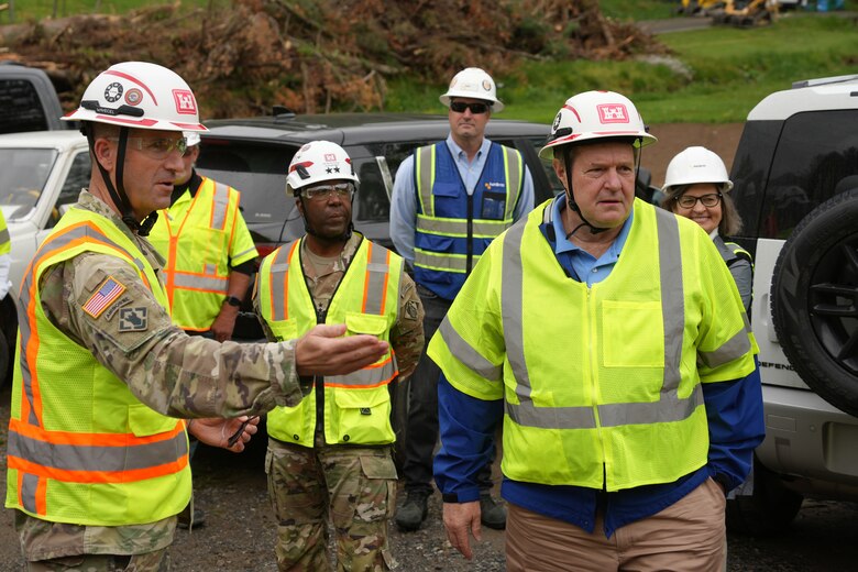 U.S. Army Corps of Engineers Wilmington District Commander Col. Brad Morgan (left), explains to Acting Assistant Secretary of the Army for Civil Works E. Lee Forsgren (right), how the private property debris removal program helps property owners impacted by Hurricane Helene get federal assistance. Forsgren visited the property on April 24, 2025 as part of his visit to western North Carolina to learn about and assess the progress being made in Hurricane Helene recovery efforts. This property was approved for USACE assistance debris removal, to include a damaged and unsafe tobacco barn that had been on the property for over 100 years.