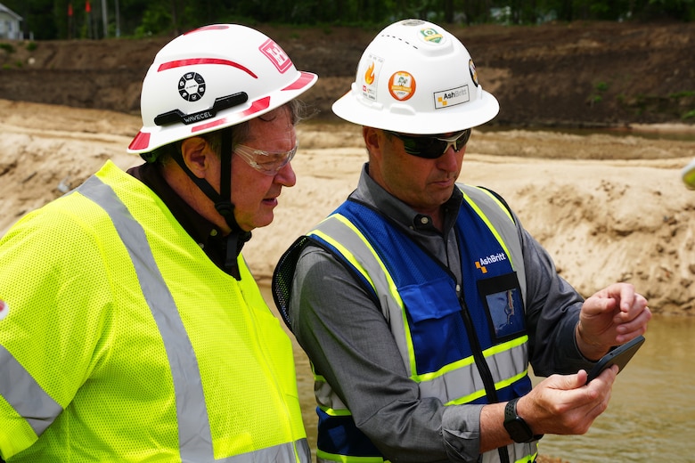 Dow Knight, senior vice president for AshBritt (prime contractor), shows video footage to Acting Assistant Secretary of the Army for Civil Works Lee Forsgren (left) of the Broad River and Lake Lure, North Carolina, area shortly after Hurricane Helene impacted the region. Comparing the initial destruction to current conditions on April 25, 2025, provides insight into the progress made, and the work that remains, as recovery efforts continue.