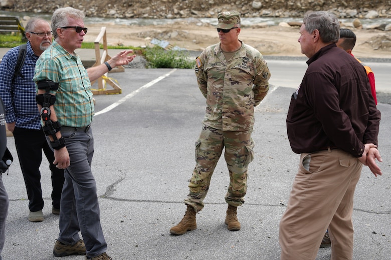 From left to right, Chimney Rock, North Carolina Mayor Peter O’Leary, explains the damage that his town saw after Hurricane Helene to U.S Army Corps of Engineers South Atlantic Division Commander Brig. Gen. Daniel Hibner, and Acting Assistant Secretary of the Army for Civil Works Lee Forsgren, on April 25, 2025. Forsgren visited the area to assess the progress being made toward recovery of the region.