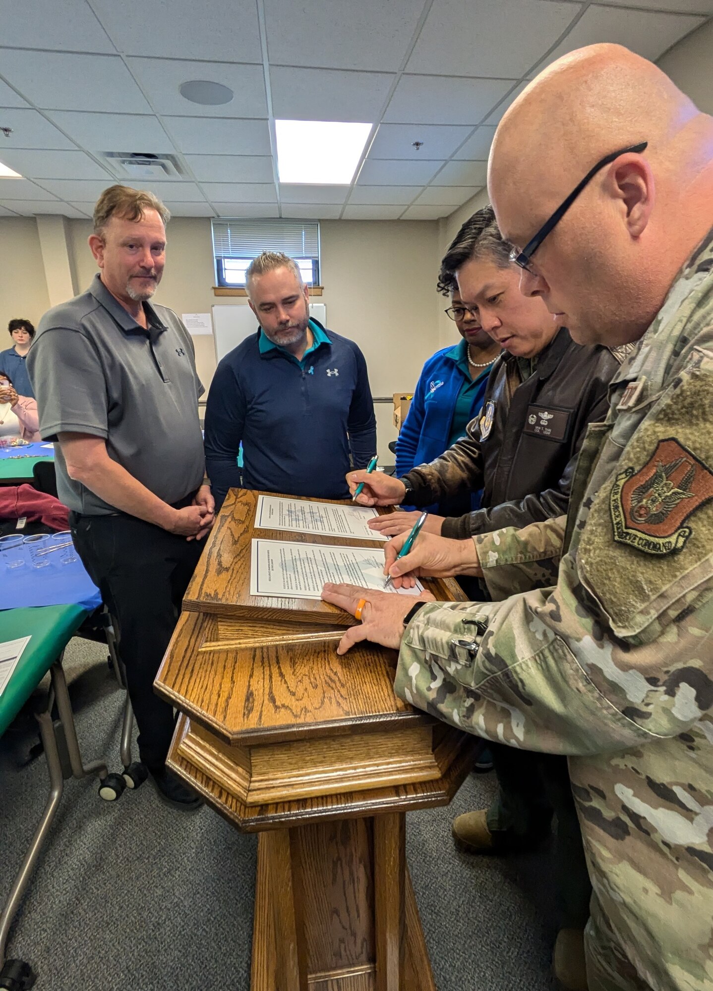 Col. Van T. Thai, 434th Air Refueling Wing Commander, and Chief Master Sgt. Chief Price, 434th ARW Command Chief, officially recognize April as Sexual Assault and Prevention Month and Child Abuse Prevention Month by signing a proclamation