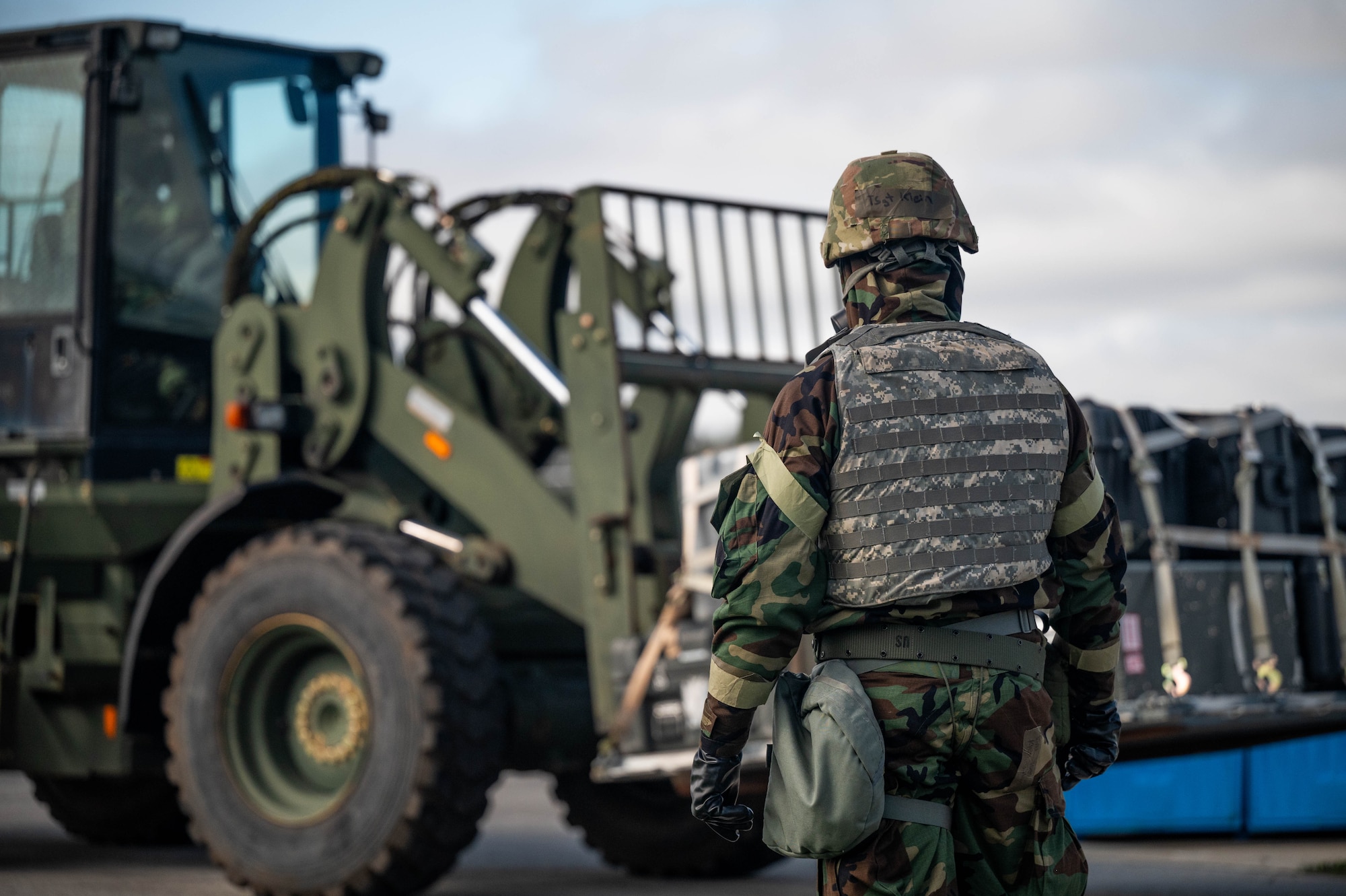 U.S. Air Force Technical Sgt. Nathan Klein, 49th Aerial Port Squadron passenger representative, watches as equipment is moved during an exercise