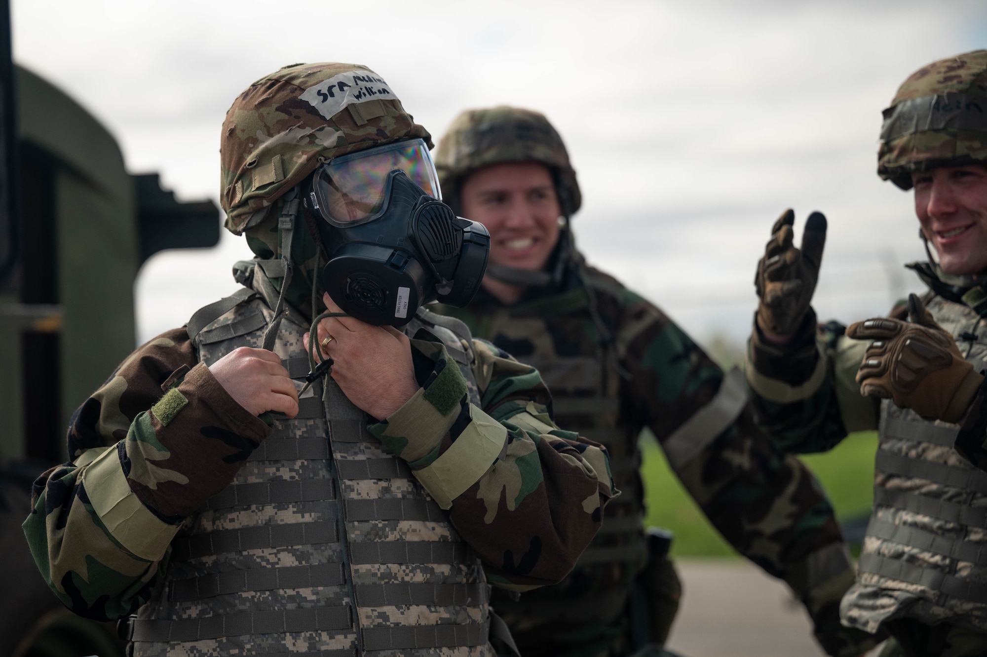 U.S. Air Force Senior Airman William McAleenan, 49th Aerial Port Squadron air transportation specialist, takes off his mask after operating a 10K All-Terrain forklift