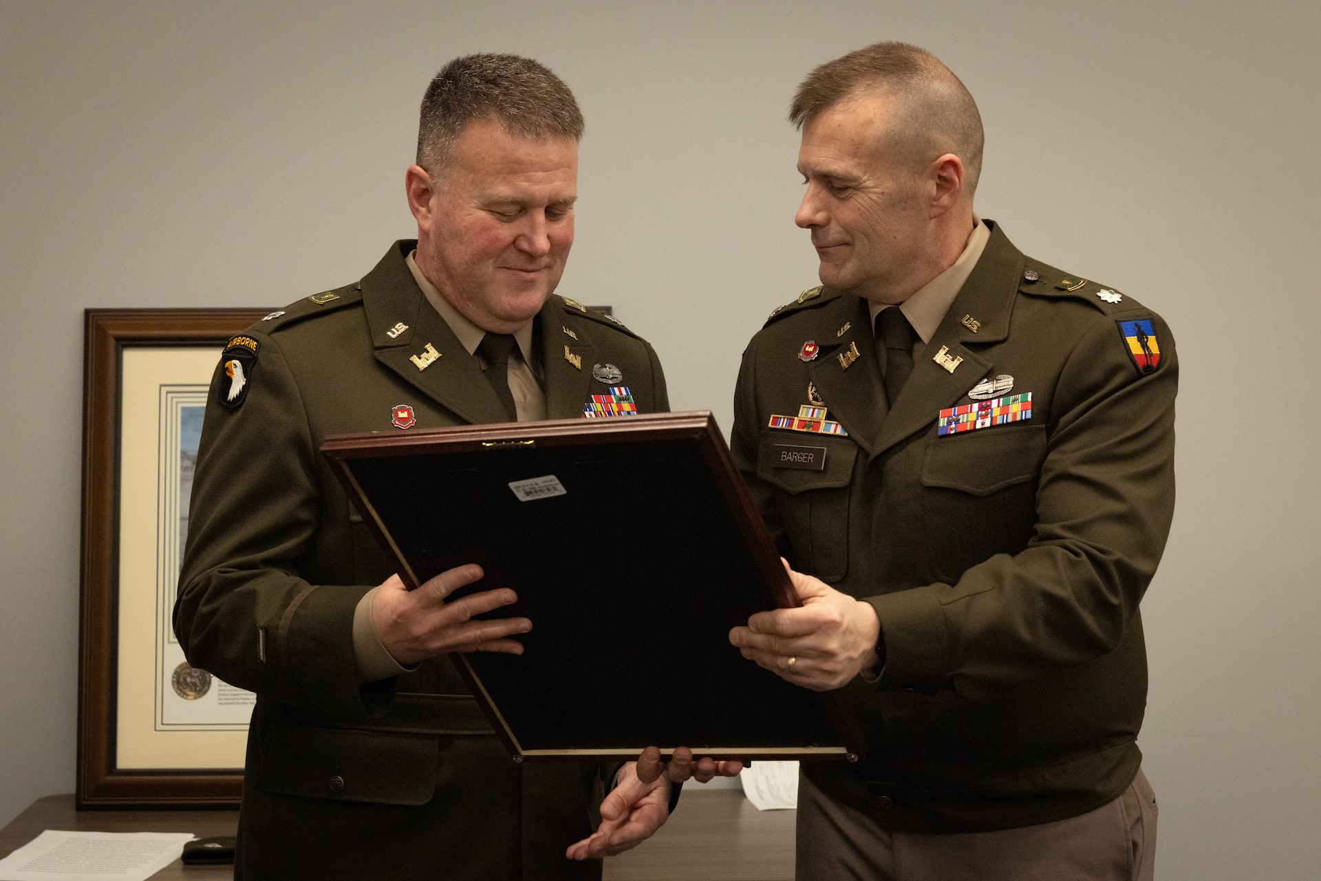 U.S. Army Lt. Col. Shannon Ison receives the Kentucky Distinguished Service Medal from Lt. Col. John Barger at his retirement ceremony at the Joint Forces Headquarters building on Boone National Guard Center in Frankfort, Ky. On April 18, 2025. Ison, a Silver Star recipient, retired after 22 years in a ceremony with friends and family present. (U.S. Army National Guard photo by Andy Dickson)