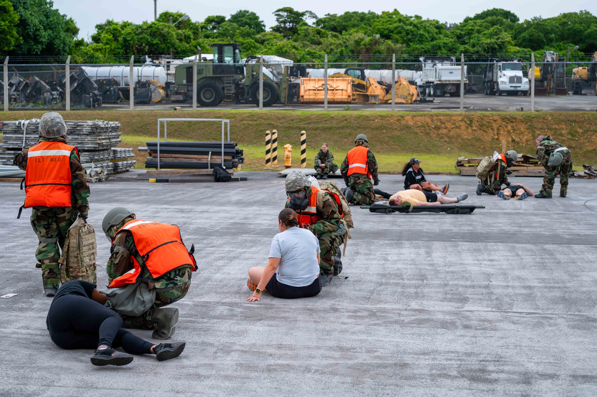 A field response team gives first aid to simulated patients on-scene in support of a health service medical reserve exercise at Kadena Air Base, Japan, April 17, 2025.