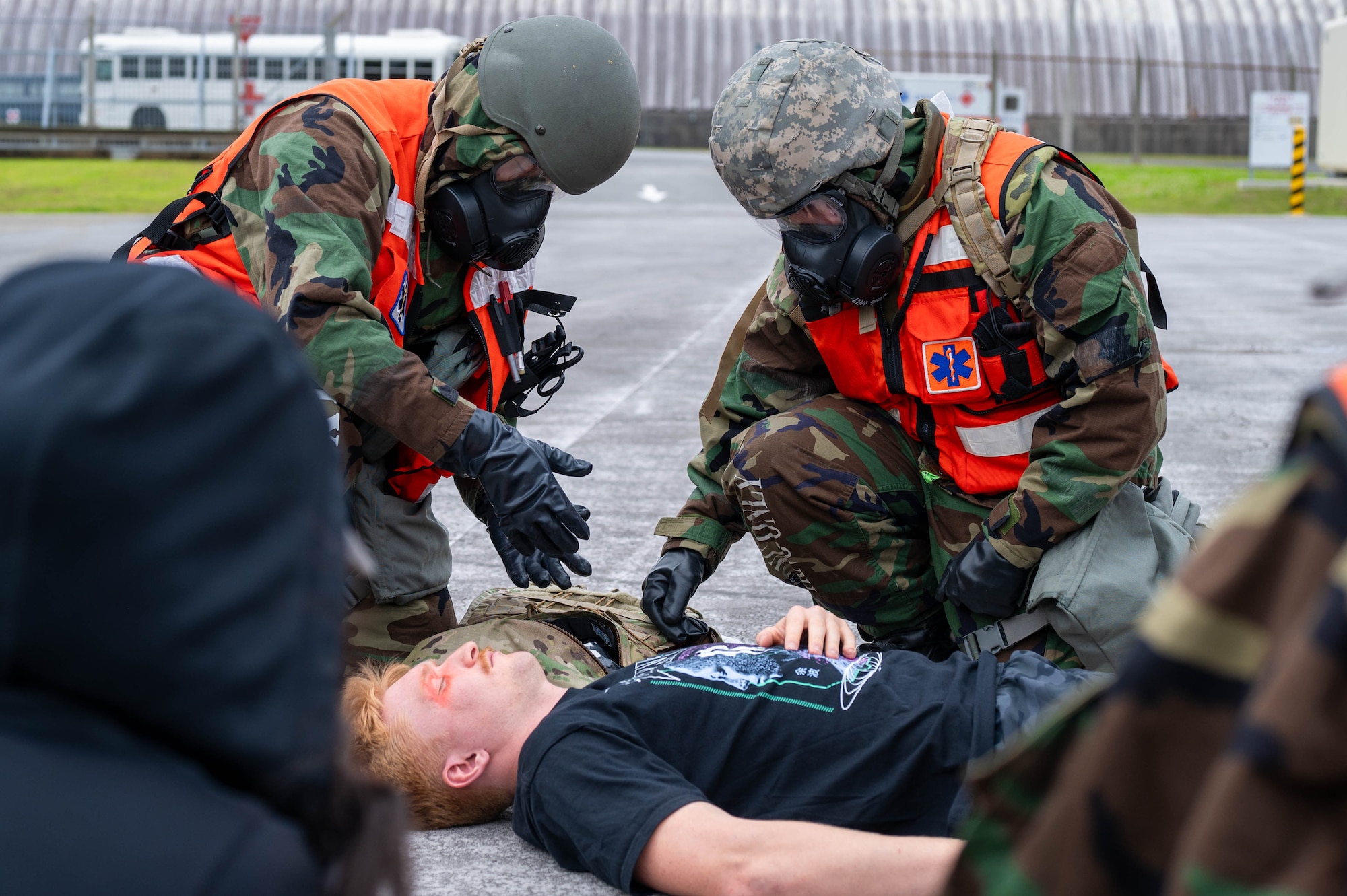 A field response team gives first aid to simulated patients on scene in support of a health service medical reserve exercise at Kadena Air Base, Japan, April 17, 2025.