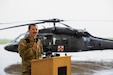 Capt. Corey Oney, 2-238th MEDEVAC commander, speaks to those in attendance of the deployment ceremony on April 25, 2025 in Frankfort, Kentucky. Approximately 30 Soldiers from the 2-238th are deploying to Europe in support of intratheater aeromedical evacuations. (U.S. Army National Guard photo by Sgt. First Class Ryan Wilhoit)