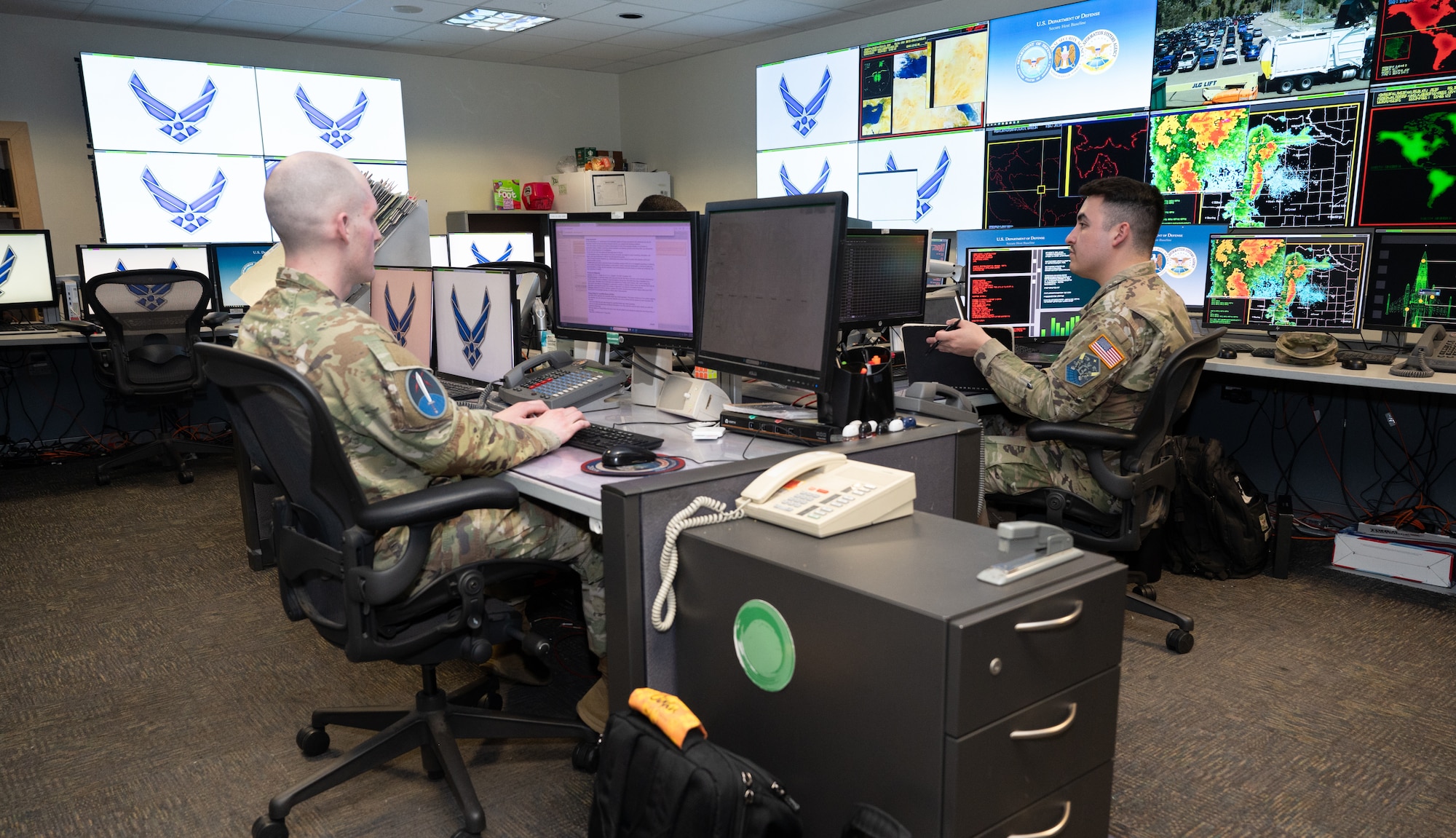 Members of the Systems Center team sit at their computers while working.