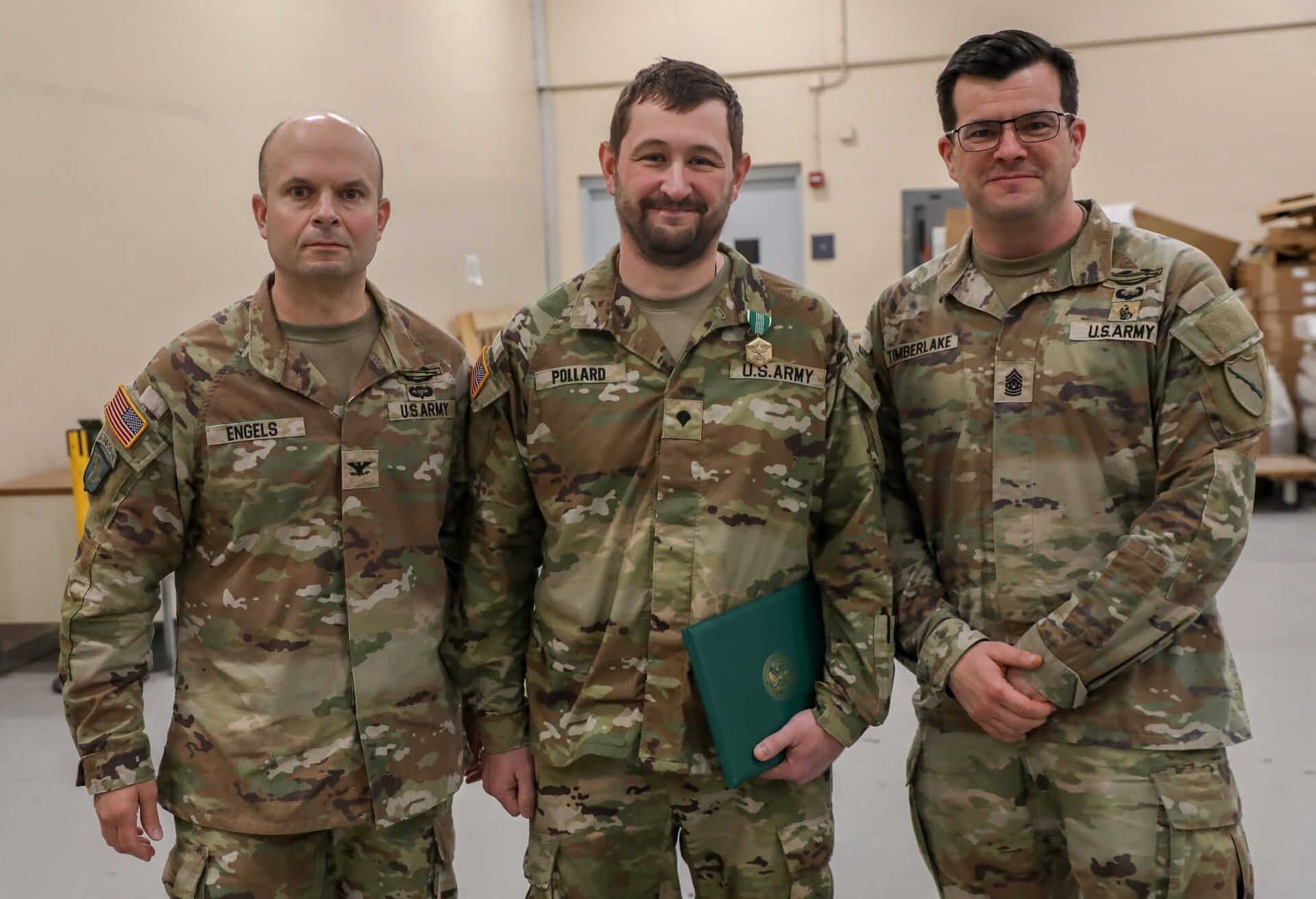 Col. Steven Engels and Command Sgt. Maj. Benzie Timberlake, 75th Troop Command, with Spc. Brandon Pollard following his heroic actions following an accident in Shelby County, March 15, 2025. Pollard helped a driver from her overturned vehicle following a weather-related crash. (U.S. Army National Guard courtesy asset)