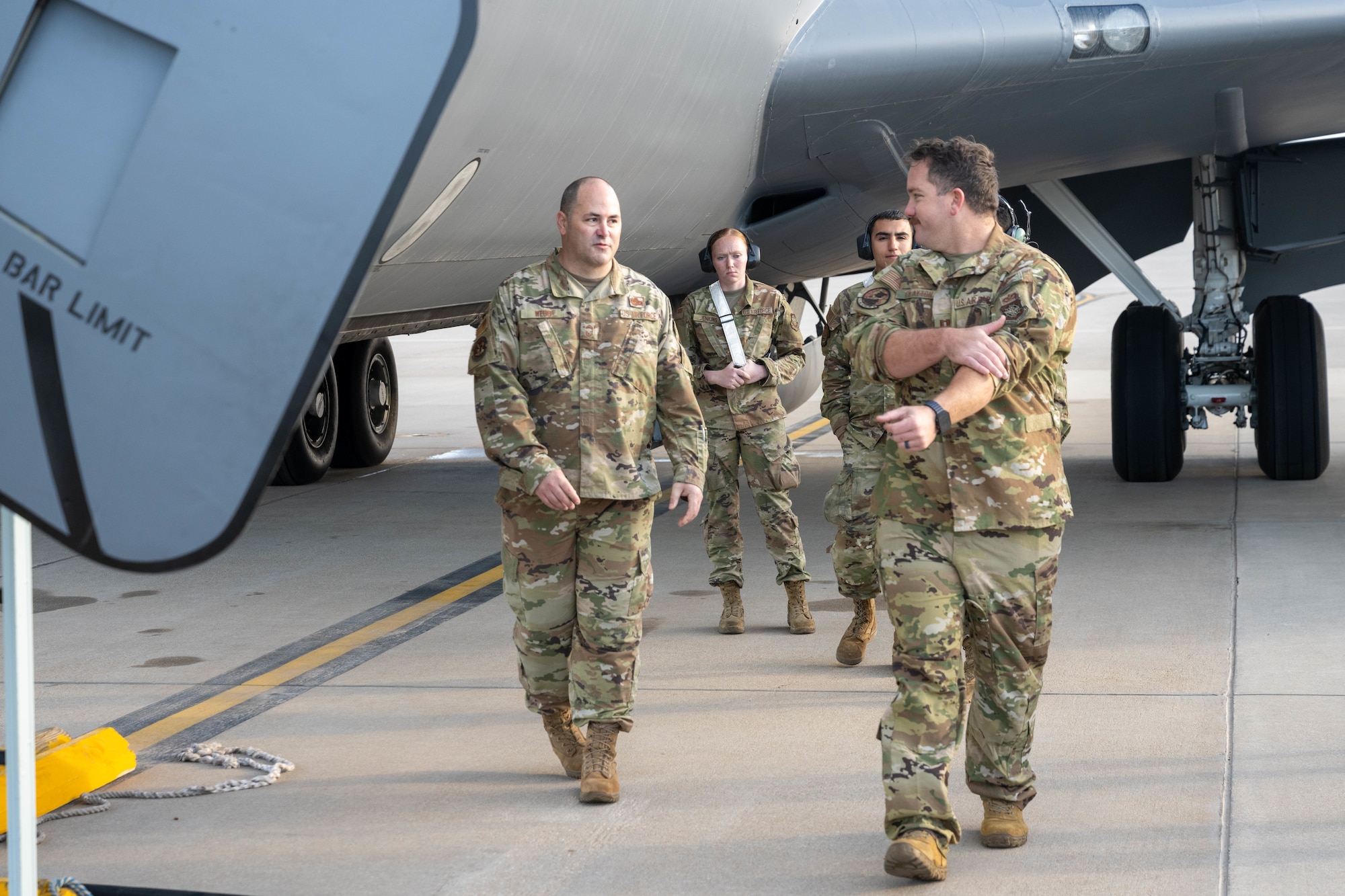 A crew prepares a KC-135 Stratotanker for takeoff.