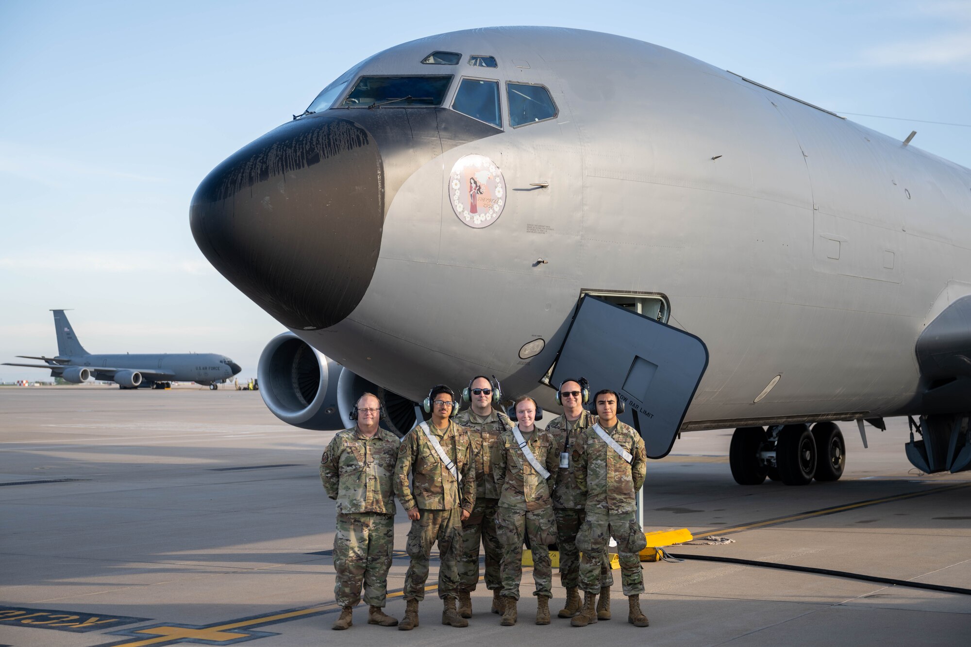 A crew poses in front of a KC-135 Stratotanker.