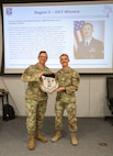 U.S. Air National Guard Senior Airman Dakota Schupp, 190th Air Refueling Wing,  poses with a plaque at Rosecrans Air National Guard Base, Missouri, April 16, 2025.
