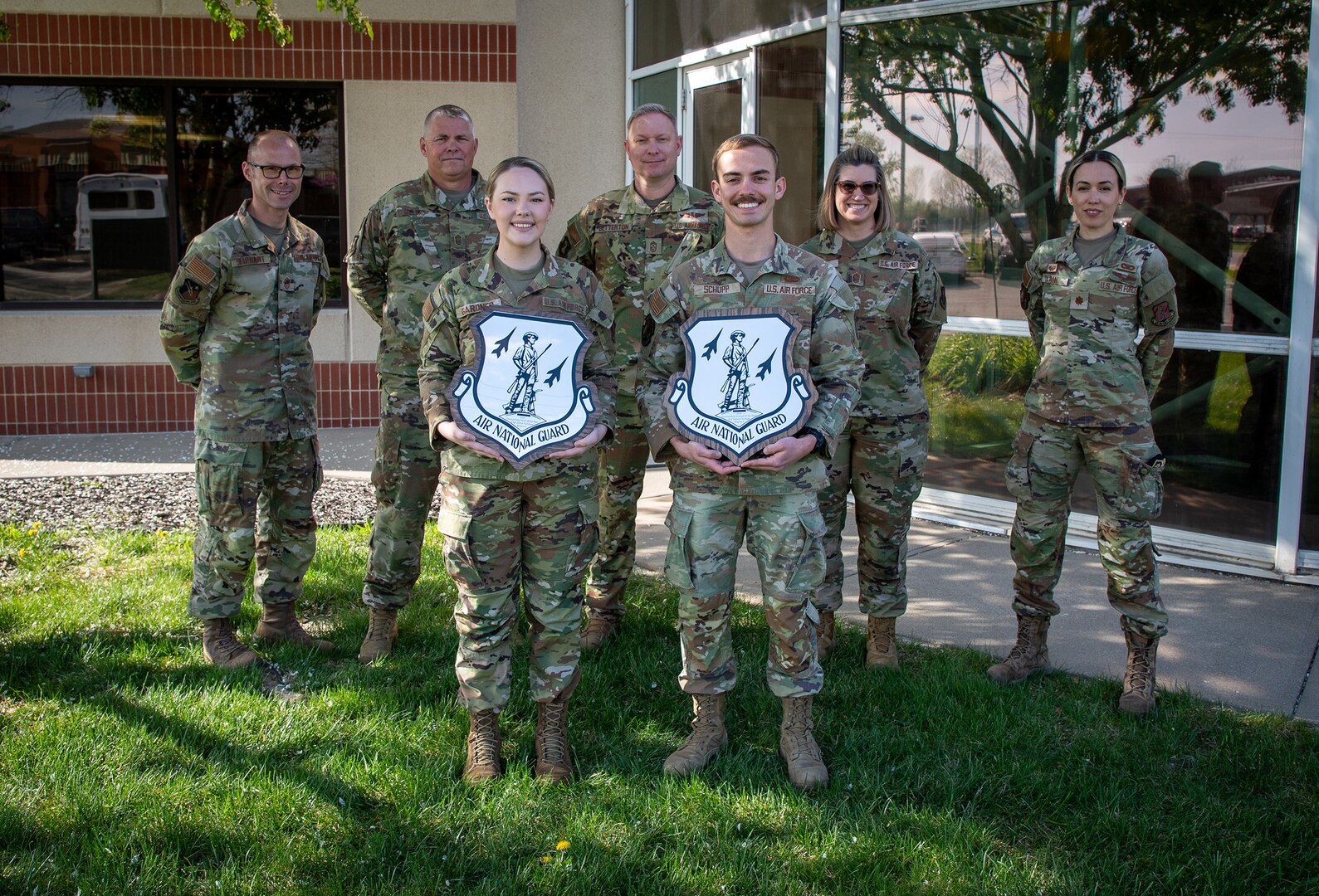 U.S. Air National Guard Senior Airman Dakota Schupp, 190th Security Forces Squadron, and Technical Sgt. Jamie Gardner, 190th Force Support Squadron, 190th Air Refueling Wing, pose for a photo with their Region 5 Outstanding Airman of the Year plaques at Rosecrans Air National Guard Base, Missouri, April 16, 2025.