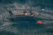 Minnesota National Guard Aviators from the 34th Combat Aviation Brigade conduct their annual Operation Burn Out with the Minnesota Department of Natural Recourses with UH-60 Blackhawk helicopters and CH-47 Chinook Helicopters at Camp Ripley Training Center near Little Falls, Minnesota, on April 16th, 2025.