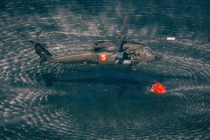 Minnesota National Guard Aviators from the 34th Combat Aviation Brigade conduct their annual Operation Burn Out with the Minnesota Department of Natural Recourses with UH-60 Blackhawk helicopters and CH-47 Chinook Helicopters at Camp Ripley Training Center near Little Falls, Minnesota, on April 16th, 2025.
