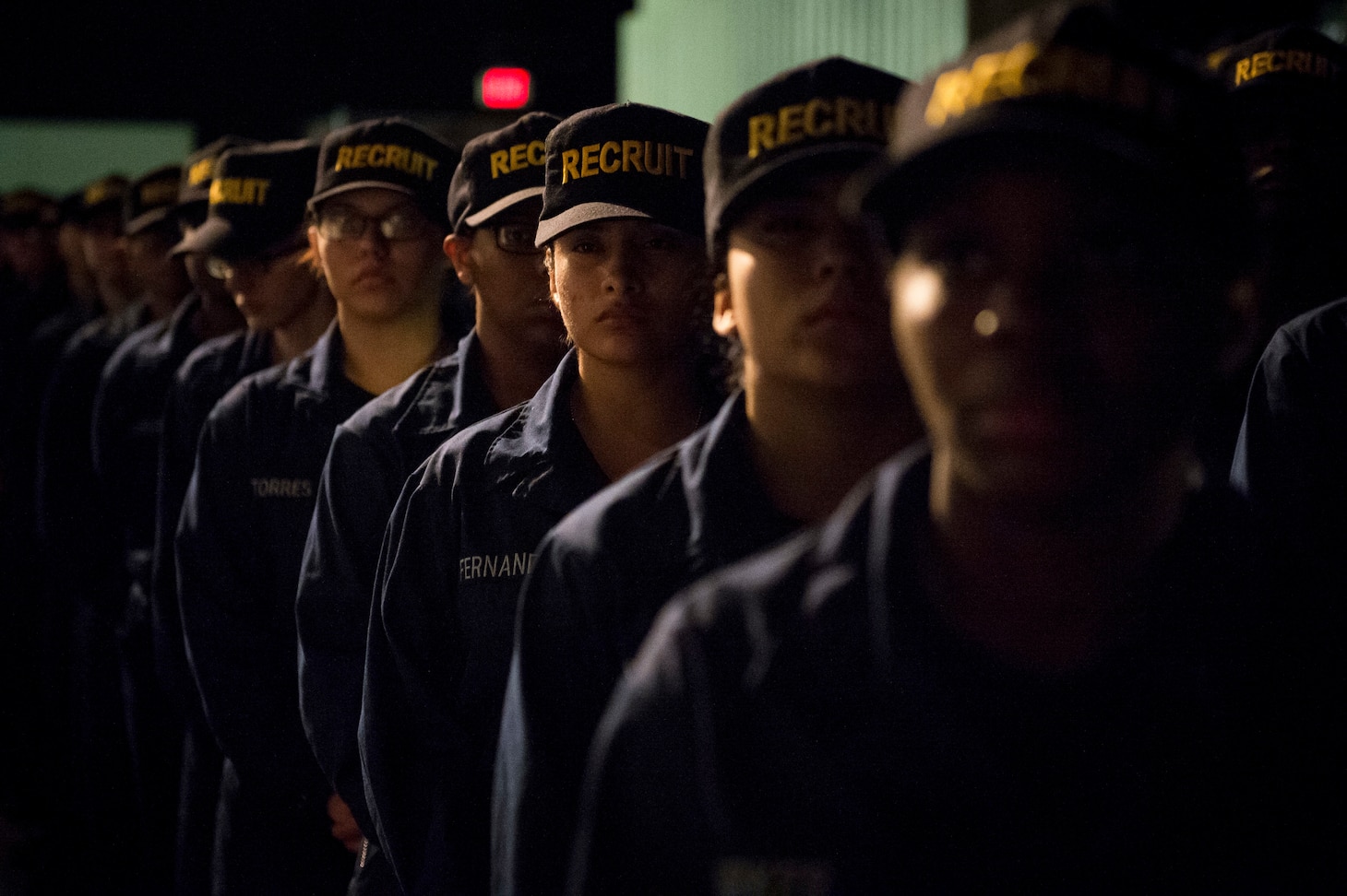150605-N-AT895-113 GREAT LAKES, Ill.  (June 5, 2015) Recruits at Recruit Training Command (RTC) at Naval Station Great Lakes prepare to receive their Navy ball caps after completing Battle Stations, the final exercise before graduation. (U.S. Navy photo by Mass Communication Specialist 1st Class Nathan Laird/Released)