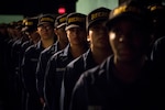 150605-N-AT895-113 GREAT LAKES, Ill.  (June 5, 2015) Recruits at Recruit Training Command (RTC) at Naval Station Great Lakes prepare to receive their Navy ball caps after completing Battle Stations, the final exercise before graduation. (U.S. Navy photo by Mass Communication Specialist 1st Class Nathan Laird/Released)