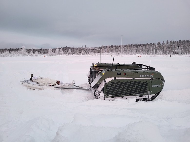 The THeMIS UGV tows an “injured” Warfighter during a simulated mass casualty event. CRREL tested the autonomous UGV’s capabilities in cold winter environments during a USSOCOM Technical Experimentation held this past winter at Camp Rødsmoen in Rena, Norway. Photo by Mike Parker, CRREL.