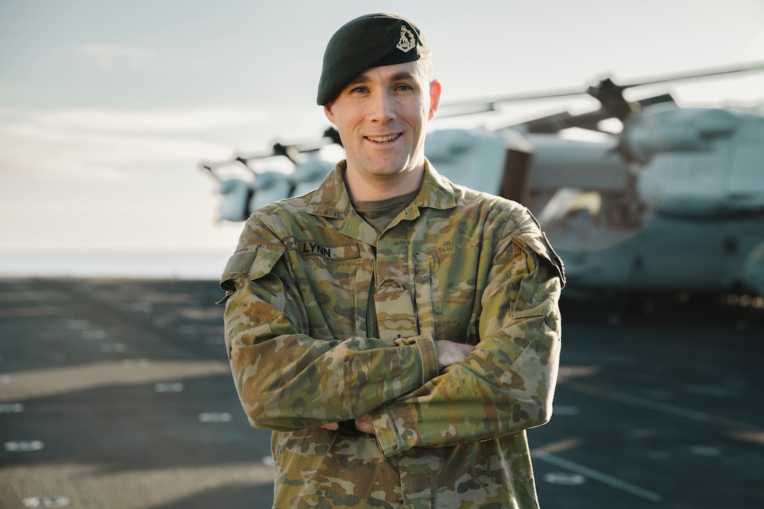 Australian Army Maj. George Lynn, the assistant operations officer of the 15th Marine Expeditionary Unit, poses for a photo aboard the amphibious assault ship USS Boxer (LHD 4) while underway in the Pacific Ocean Nov. 21, 2024. Lynn recently deployed with the 15th MEU to the Indo-Pacific region as part of the Marine Corps Personnel Exchange Program. (U.S. Marine Corps photo by Cpl. Luis Agostini)