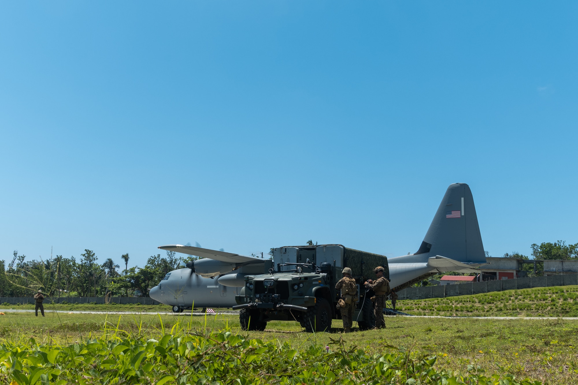 A U.S. Marine Corps Joint Light Tactical Vehicle with leader kit assigned to Medium-Range Missile Battery, 3d Littoral Combat Team, 3d Marine Littoral Regiment, 3d Marine Division offloads from a U.S. Air Force C-130J Super Hercules assigned to 39th Airlift Squadron during Exercise Balikatan 25 at Basco, Philippines, April 26, 2025. This marks the inaugural deployment of the newly fielded Marine Corps weapon system to the Philippines and serves as a major milestone for the continuously developing U.S.-Philippines Alliance. Balikatan is a longstanding annual exercise between the Armed Forces of the Philippines and U.S. military designed to strengthen our ironclad alliance, improve our capable combined force, and demonstrate our commitment to regional security and stability. (U.S. Marine Corps photo by Chief Warrant Officer 2 Trent Randolph)