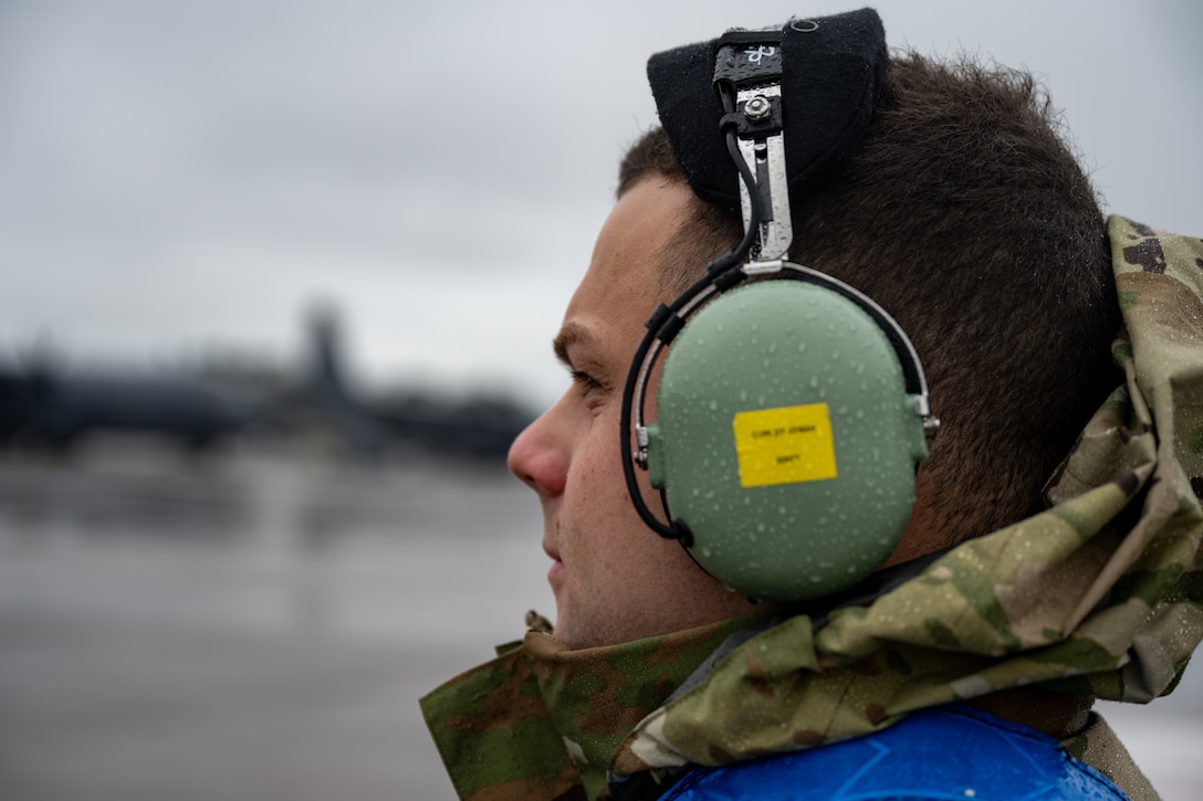A U.S. Air Force crew chief assigned to the 1st Special Operations Wing prepares to marshal a crew aboard an MC-130J Commando II to the runway at Hurlburt Field, Florida, Feb. 19, 2025. Hurlburt Field maintainers are dedicated to ensuring the 1 SOW can complete its mission anytime, anywhere by providing safe, reliable and combat-ready aircraft and equipment. (U.S. Air Force photo by Senior Airman Hussein Enaya)