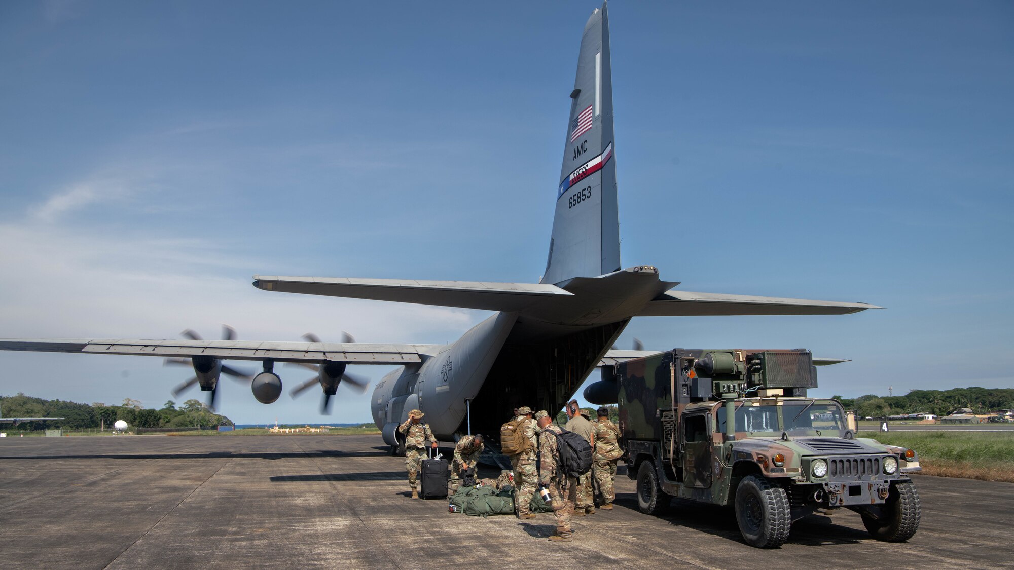U.S. Army soldiers with the 5th Battalion, 3rd Field Artillery Regiment, 1st Multi-Domain Task Force, offload a Humvee during Exercise Balikatan 25 at Antonio Bautista Air Base, Puerto Princesa, Philippines, April 23, 2025. Balikatan is a longstanding annual exercise between the Armed Forces of the Philippines and U.S. military designed to strengthen our ironclad alliance, improve our capable combined force, and demonstrate our commitment to regional security and stability. (U.S. Marine Corps photo by Sgt. Mitchell Johnson)