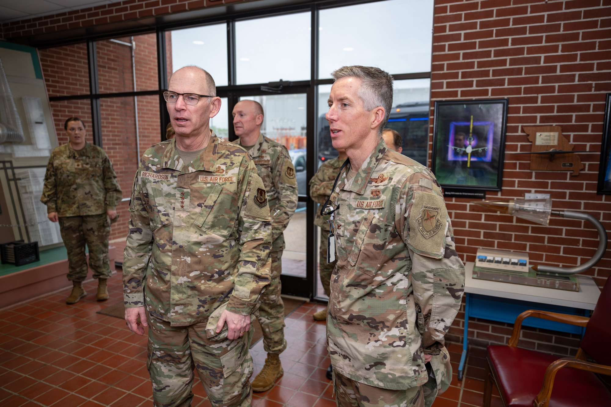 Gen. Duke Z. Richardson, commander of Air Force Materiel Command, left, speaks with Col. Grant Mizell, commander of Arnold Engineering Development Complex, during a stop in the Propulsion Wind Tunnel Facility lobby as part of an April 24, 2025, visit to Arnold AFB, Tenn. The base serves as the headquarters of AEDC. Richardson visited Arnold AFB, headquarters of AEDC, to tour several test facilities, meet with personnel, and receive updates on various programs and projects. (U.S. Air Force photo by Keith Thornburgh)