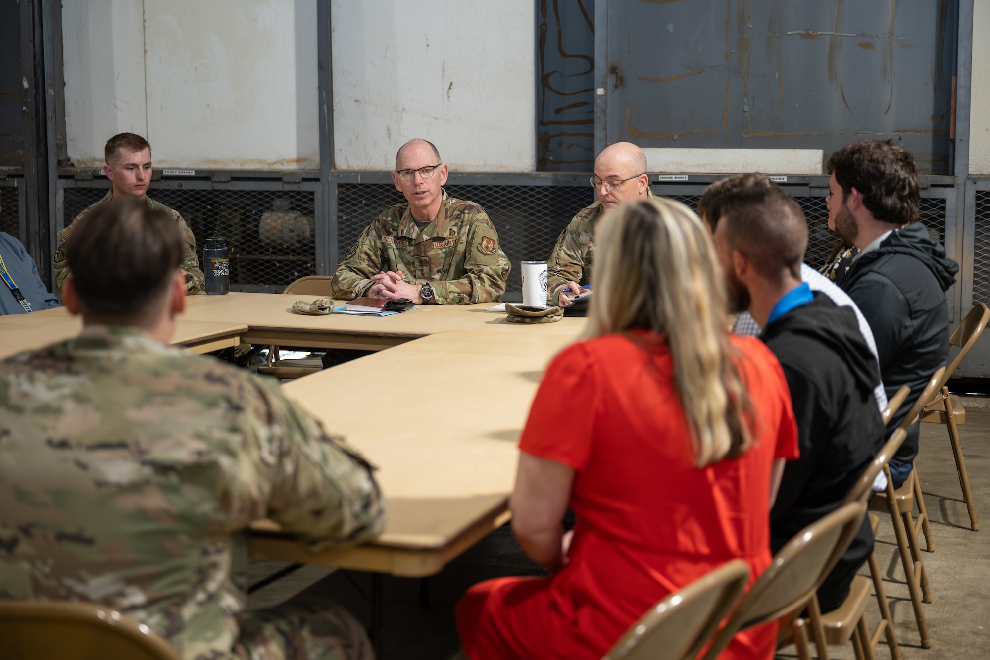 Gen. Duke Z. Richardson, commander of Air Force Materiel Command, center left, and Chief Master Sgt. Bill Fitch, AFMC Command Chief Master Sergeant, center right, meet with members of the Arnold Engineering Development Complex Junior Force Council during an April 24, 2025, visit to Arnold Air Force Base, Tenn. Richardson visited Arnold AFB, headquarters of AEDC, to tour several test facilities, meet with personnel, and receive updates on various programs and projects. (U.S. Air Force photo by Keith Thornburgh)