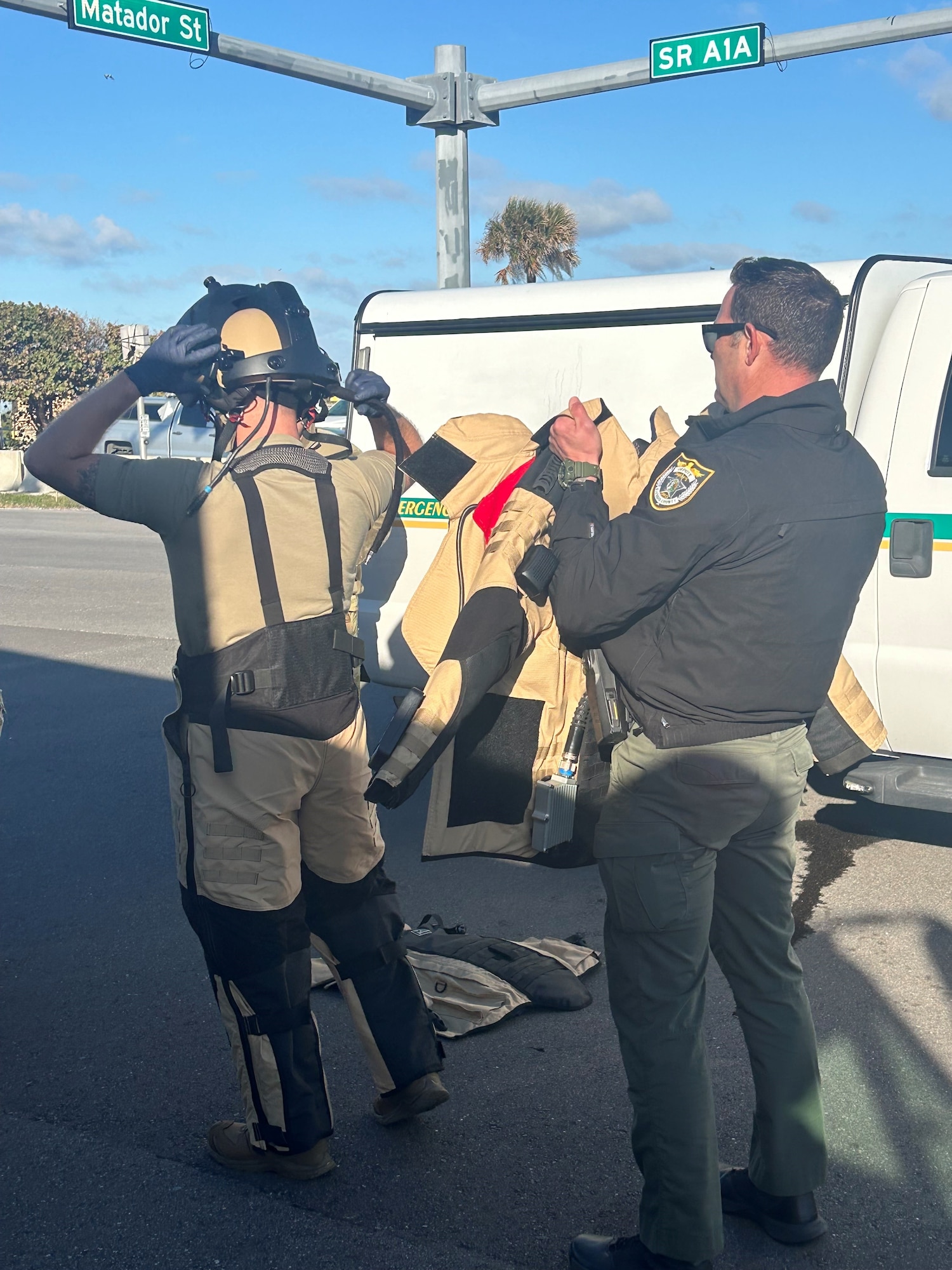An Airman puts on a bomb suit