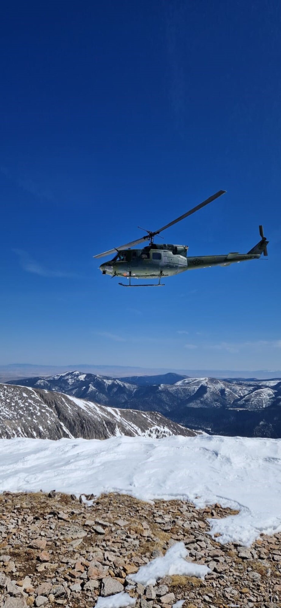 Helicopter flying in the mountains
