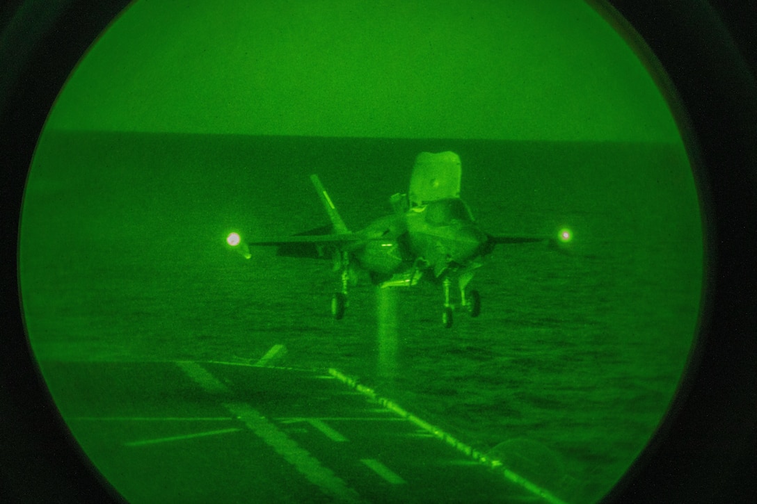 A U.S. Marine Corps F-35B Lightning II aircraft with Marine Fighter Attack Squadron (VMFA) 121 prepares to land aboard the amphibious assault ship USS Tripoli (LHA 7)