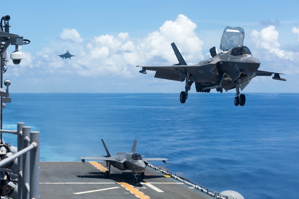 U.S. Marine Corps F-35B Lightning II aircraft with Marine Fighter Attack Squadron 121 approach and land on the amphibious assault carrier USS Tripoli (LHA 7) during Valiant Shield 2022 (VS22), June 15, 2022. Exercises such as Valiant Shield allows the Indo-Pacific Command Joint Task Force the opportunity to integrate forces from all branches of service to conduct long-range, precise, lethal, and overwhelming multi-axis, multi-domain effects that demonstrate the strength and versatility of the Joint Task Force and our commitment to a free and open Indo-Pacific. (U.S. Marine Corps photo by Sgt. Jackson Ricker)