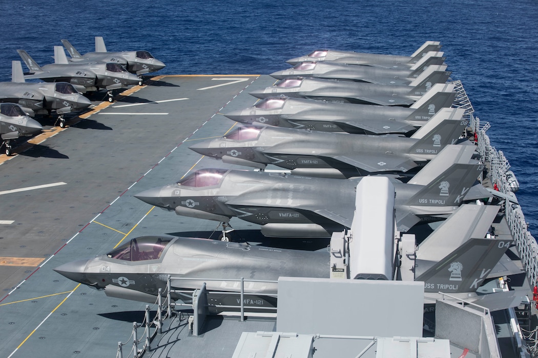 U.S. Marine Corps F-35B Lightning II aircraft with Marine Fighter Attack Squadron 121 stage aboard the amphibious assault carrier USS Tripoli (LHA 7) during Valiant Shield 2022 (VS22), June 12, 2022. Exercises such as Valiant Shield allows the Indo-Pacific Command Joint Task Force the opportunity to integrate forces from all branches of service to conduct long-range, precise, lethal, and overwhelming multi-axis, multi-domain effects that demonstrate the strength and versatility of the Joint Task Force and our commitment to a free and open Indo-Pacific. (U.S. Marine Corps photo by Sgt. Jackson Ricker)