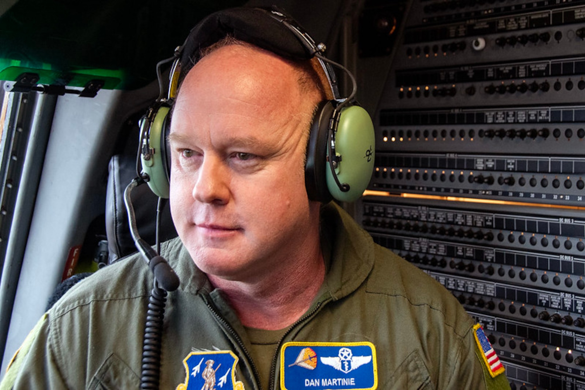 U.S. Air Force Col. Daniel Martinie, North Carolina Joint Force Headquarters-Air, State Air Surgeon poses for a photo in the cockpit of a C-17 Globemaster III on the flightline at Charlotte-Douglas International Airport base, March 8, 2025.