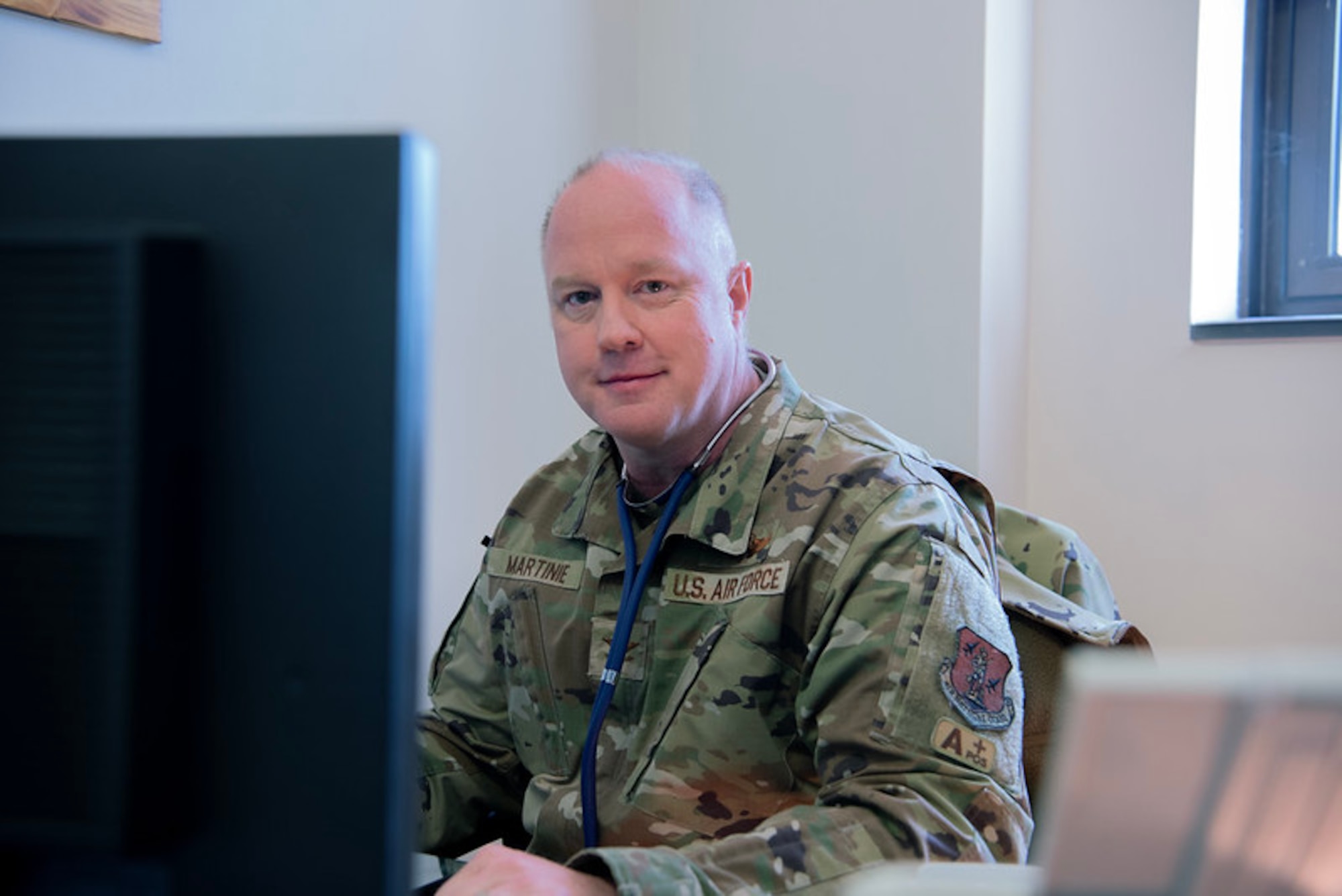 U.S. Air Force Col. Daniel Martinie, North Carolina Joint Force Headquarters-Air, State Air Surgeon poses for a photo at Charlotte-Douglas International Airport base, March 8, 2025.