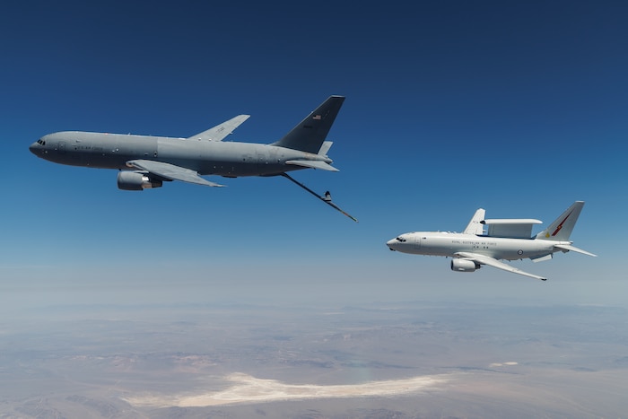 A KC-46A assigned to the 418th Flight Test Squadron at Edwards Air Force Base positions to refuel a Royal Australian Air Force E-7A Wedgetail in the airspace near Edwards. Aircrews from the USAF, RAAF, and Royal Air Force worked together to rapidly certify this enhanced combat capability for the RAAF E-7A fleet. The trilateral test also allowed the United Kingdom and United States Air Force to gain early test experience ahead of their anticipated fielding of E-7 aircraft variants. (Air Force photo by Richard Gonzales)