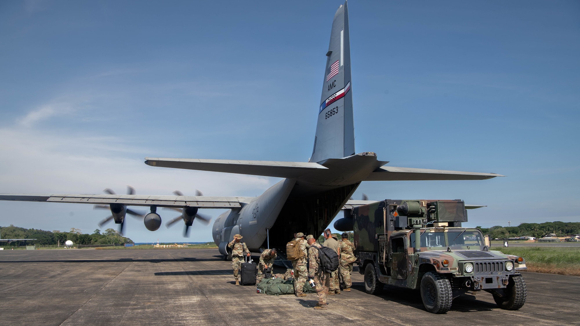U.S. Army soldiers with the 5th Battalion, 3rd Field Artillery Regiment, 1st Multi-Domain Task Force, offload a Humvee during Exercise Balikatan 25 at Antonio Bautista Air Base, Puerto Princesa, Philippines, April 23, 2025. Balikatan is a longstanding annual exercise between the Armed Forces of the Philippines and U.S. military designed to strengthen our ironclad alliance, improve our capable combined force, and demonstrate our commitment to regional security and stability. (U.S. Marine Corps photo by Sgt. Mitchell Johnson)
