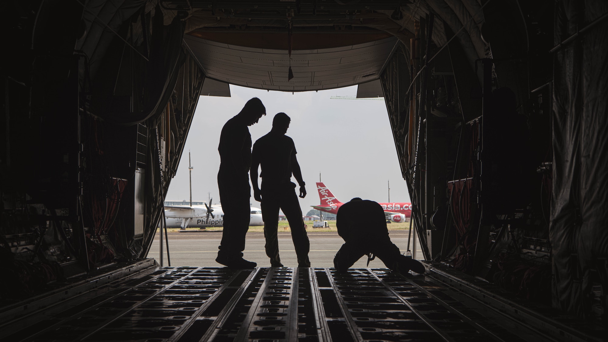 U.S. Airmen with the 39th Airlift Squadron, prepare a C-130J Super Hercules, for a U.S. Army Humvee assigned to 5th Battalion, 3rd Field Artillery Regiment, 1st Multi Domain Task Force, transport during Exercise Balikatan 25 at at Clark Air Base, Philippines, April 23, 2025. Balikatan is a longstanding annual exercise between the Armed Forces of the Philippines and U.S. military designed to strengthen our ironclad alliance, improve our capable combined force, and demonstrate our commitment to regional security and stability. (U.S. Marine Corps photo by Sgt. Mitchell Johnson)