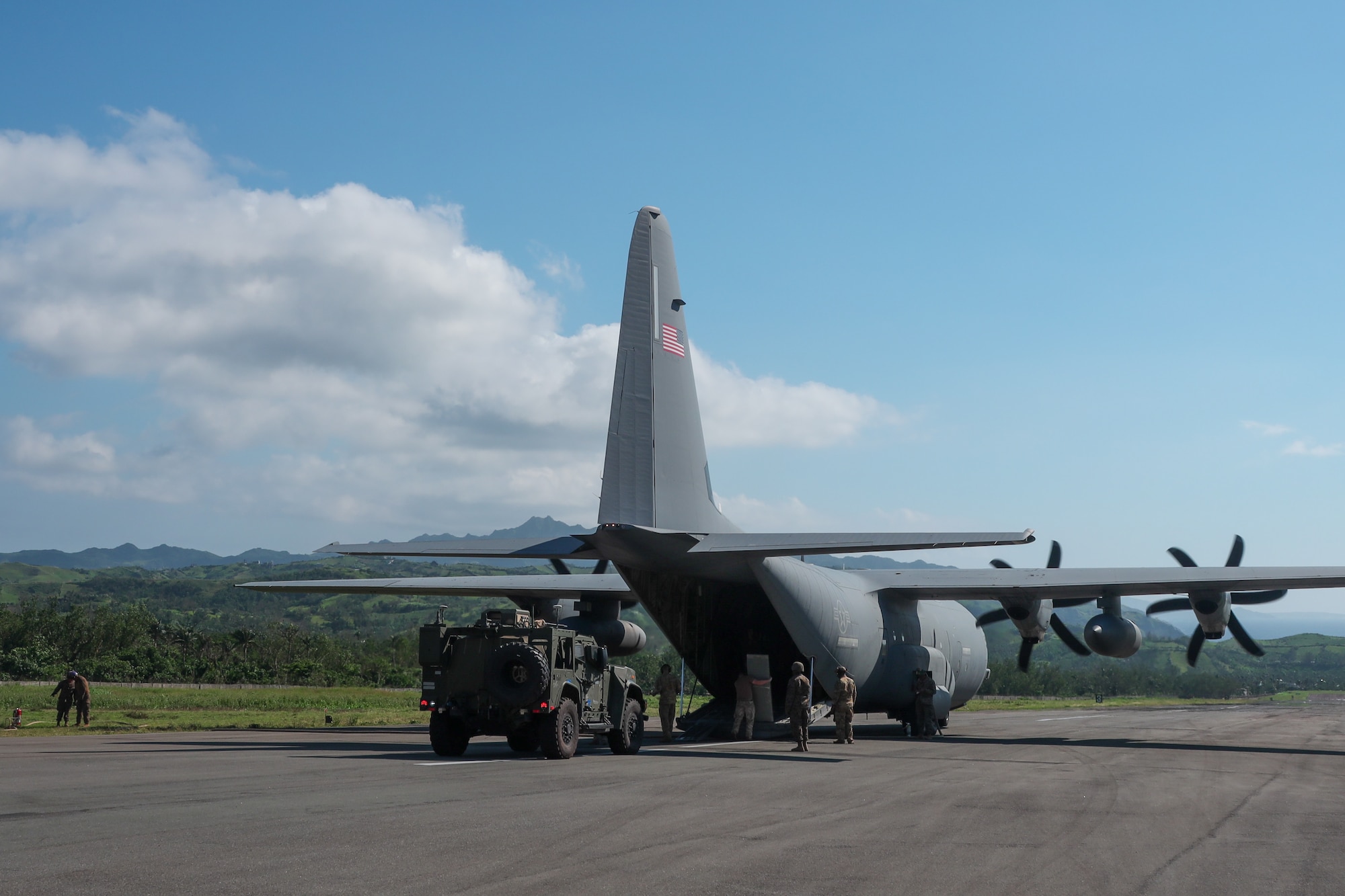 A U.S. Marine Corps Joint Light Tactical Vehicle with leader kit assigned to Medium-Range Missile Battery, 3d Littoral Combat Team, 3d Marine Littoral Regiment, 3d Marine Division offloads from a U.S. Air Force C-130J Super Hercules assigned to 39th Airlift Squadron during Exercise Balikatan 25 at Basco, Philippines, April 26, 2025. This marks the inaugural deployment of the newly fielded Marine Corps weapon system to the Philippines and serves as a major milestone for the continuously developing U.S.-Philippines Alliance. Balikatan is a longstanding annual exercise between the Armed Forces of the Philippines and U.S. military designed to strengthen our ironclad alliance, improve our capable combined force, and demonstrate our commitment to regional security and stability. (U.S. Marine Corps photo by Chief Warrant Officer 2 Trent Randolph)