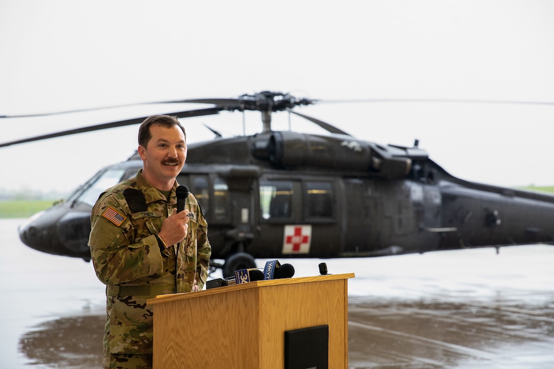 Capt. Corey Oney, 2-238th MEDEVAC commander, speaks to those in attendance of the deployment ceremony on April 25, 2025 in Frankfort, Kentucky. Approximately 30 Soldiers from the 2-238th are deploying to Europe in support of intratheater aeromedical evacuations. (U.S. Army National Guard photo by Sgt. First Class Ryan Wilhoit)