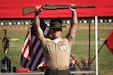 U.S. Marine Corps Staff Sgt. Payton Garcia, an expeditionary fuels technician, instructor and competitor with the Marine Corps Shooting Team, Weapons Training Battalion, holds up an M1 Garand rifle during the Marine Corps Championships Award Ceremony hosted by WTBn at Marine Corps Base Quantico, Virginia, April 18, 2025. The M1 Garand rifle was presented to the first-place competitor who attained the highest aggregate score of the Individual Rifle Match and the Individual Pistol Match. (U.S. Marine Corps photo by Cpl. Joshua Barker)