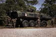 U.S. Marines with Charlie Company, Battalion Landing Team 1st Battalion, 7th Marine Regiment, 31st Marine Expeditionary Unit, exit from a U.S. Marine Corps Amphibious Combat Vehicle assigned to Charlie Company, BLT 1/7, 31st MEU, during a simulated force-on-force mechanized raid at Combat Town, Camp Hansen, Okinawa, Japan, April 24, 2025. The purpose of the exercise was to create a challenging, realistic training environment with the integration of the newly fielded ACV that produces combat-ready forces in urban terrain. The 31st MEU, the Marine Corps’ only continuously forward-deployed MEU, provides a flexible and lethal force, ready to perform a wide range of military operations as the premiere crisis response force in the Indo-Pacific region. (U.S. Marine Corps photo by Cpl. Angel Diaz Montes De Oca)
