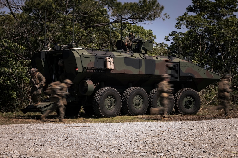 U.S. Marines with Charlie Company, Battalion Landing Team 1st Battalion, 7th Marine Regiment, 31st Marine Expeditionary Unit, exit from a U.S. Marine Corps Amphibious Combat Vehicle assigned to Charlie Company, BLT 1/7, 31st MEU, during a simulated force-on-force mechanized raid at Combat Town, Camp Hansen, Okinawa, Japan, April 24, 2025. The purpose of the exercise was to create a challenging, realistic training environment with the integration of the newly fielded ACV that produces combat-ready forces in urban terrain. The 31st MEU, the Marine Corps’ only continuously forward-deployed MEU, provides a flexible and lethal force, ready to perform a wide range of military operations as the premiere crisis response force in the Indo-Pacific region. (U.S. Marine Corps photo by Cpl. Angel Diaz Montes De Oca)