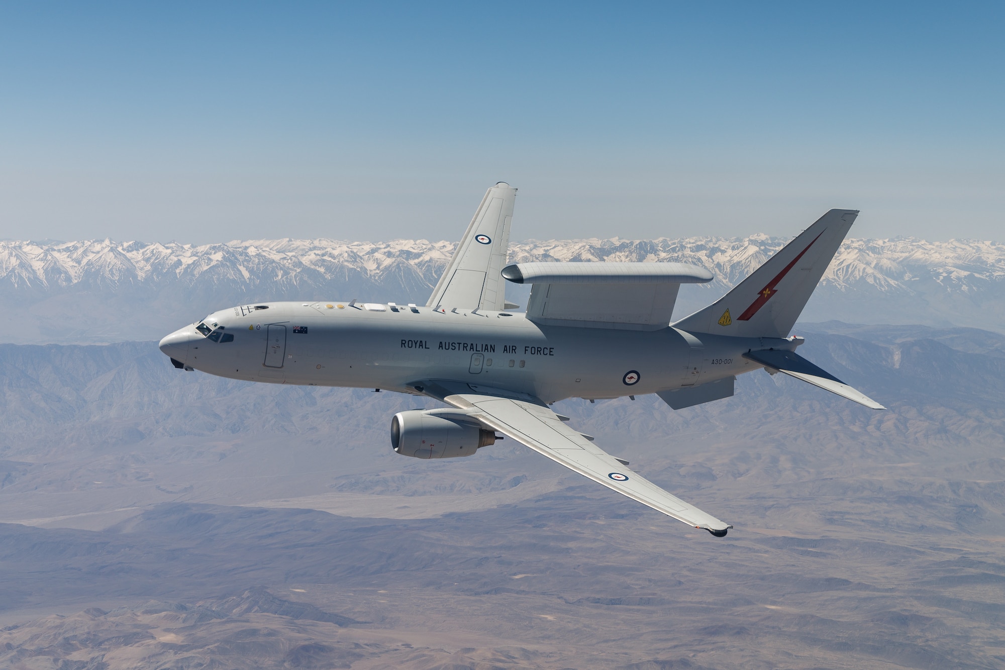 A Royal Australian Air Force E-7A Wedgetail soars over Southern California. Aircrews from the USAF, RAAF, and Royal Air Force worked together to rapidly certify the RAAF E-7A with the United States Air Force KC-46A. The trilateral test also allowed the United Kingdom and United States Air Force to gain early test experience ahead of their anticipated fielding of E-7 aircraft variants. (Air Force photo by Richard Gonzales)