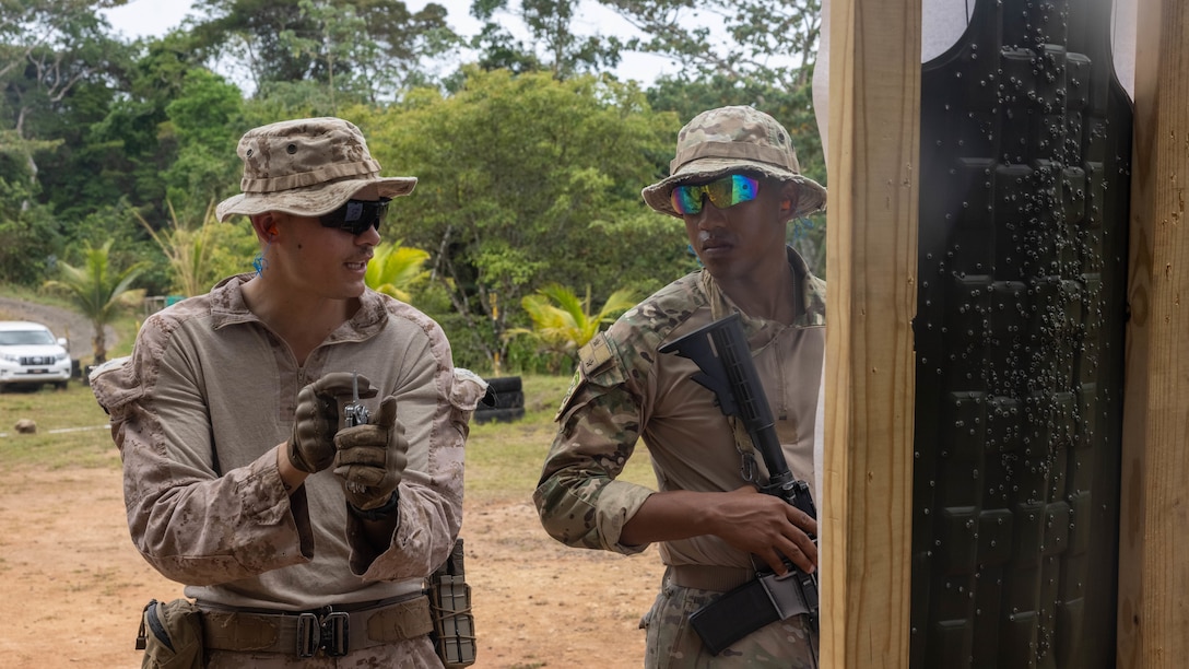U.S. Marine Corps Cpl. Christian Cardona, a Salinas, Puerto Rico native and team leader with 1st Battalion, 8th Marines, 6th Regiment, 2d Marine Division gives advice on how to achieve better shot grouping to a Panamanian security force member in Horoko, Panama, April 19, 2025. U.S. Southern Command is focused on increasing partner nation capacity and interoperability in the region and reflects the United States’ enduring promise of friendship, partnership, and solidarity with the Panamanian people. (U.S. Marine Corps photo by Lance Cpl. Francis Hrosar)