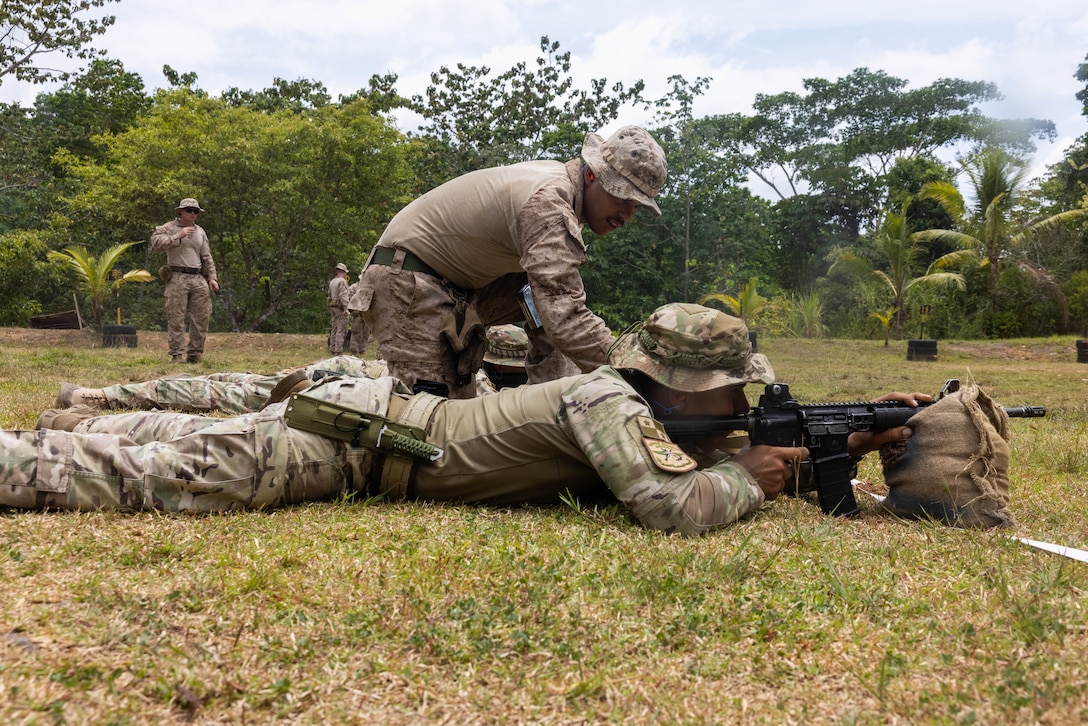 U.S. Marine Corps Lance Cpl. Jesus Reynoso Guzman, a Bronx, New York native and team leader with 1st Battalion, 8th Marines, 6th Regiment, 2d Marine Division advises a Panamanian security force member on how to zero his rifle in Horoko, Panama, April 19, 2025. U.S. Southern Command is focused on increasing partner nation capacity and interoperability in the region and reflects the United States’ enduring promise of friendship, partnership, and solidarity with the Panamanian people. (U.S. Marine Corps photo by Lance Cpl. Francis Hrosar)